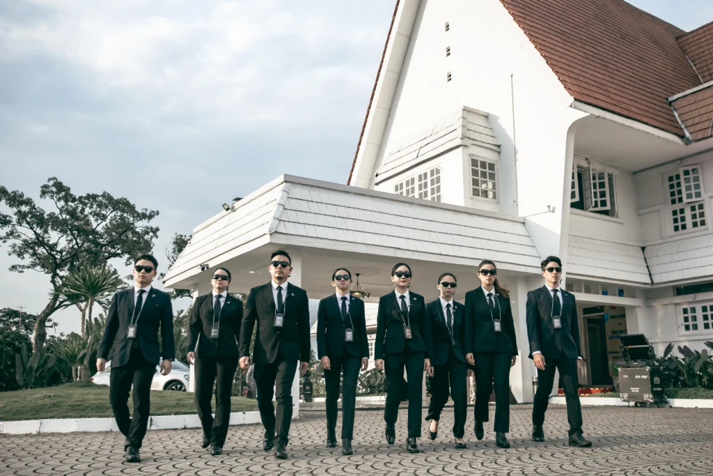 ARMSTEL elite security team in uniform walking with confidence outside headquarters