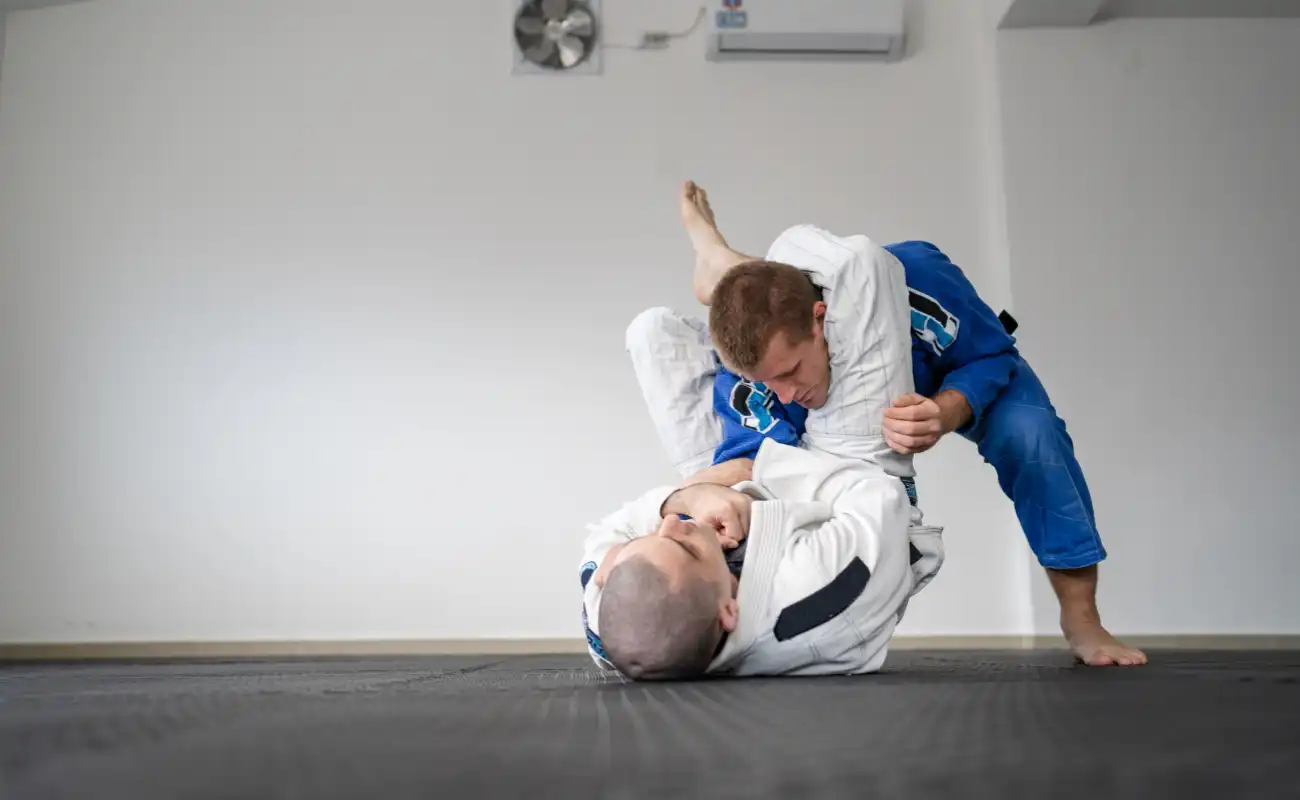 Trainees practicing hand-to-hand combat technique in close quarters environment